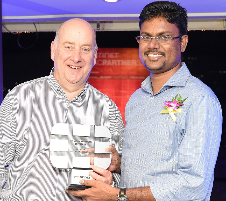 Viraj De Mendis, Senior Consulting Engineer, Millennium Information Technologies, Receiving the Best Partner 2016 award for Sri Lanka from Darren Turnbull, Vice President Strategic Solutions at Fortinet.