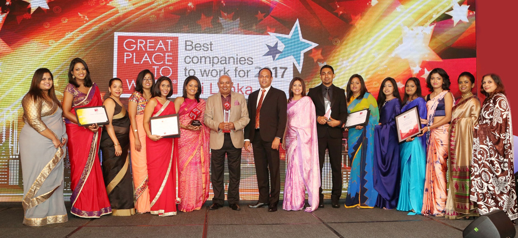 Chairman and Managing Director DIMO Ranjith Pandithage with the team at the Great Place to Work awards ceremony.