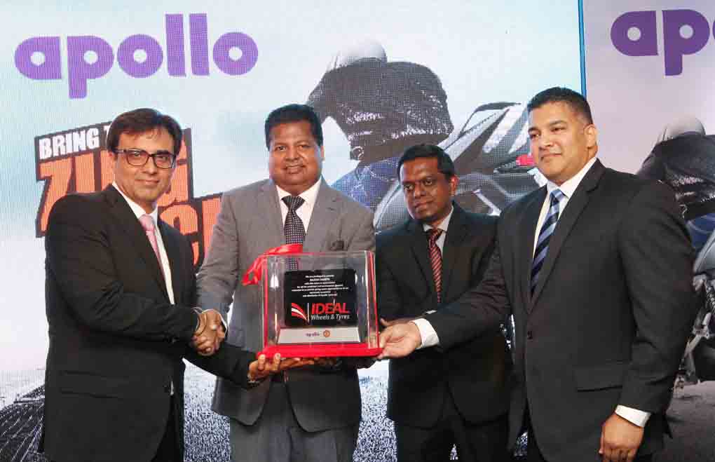 A memento from Ideal Wheels & Tyres being presented to Mr  Rajesh Dahiya – Group Head Sales ISO [ India, SAARC, OCEANIA ] Apollo Tyres Ltd by  Mr Nalin Welgama - Chairman Ideal Wheels & Tyres  and Mr Jagath Samarasekera – CEO Ideal Wheels & Tyres . Also pictured is Mr Mayank Gupta – Technical and Business Development Manager, Apollo Tyres Ltd.