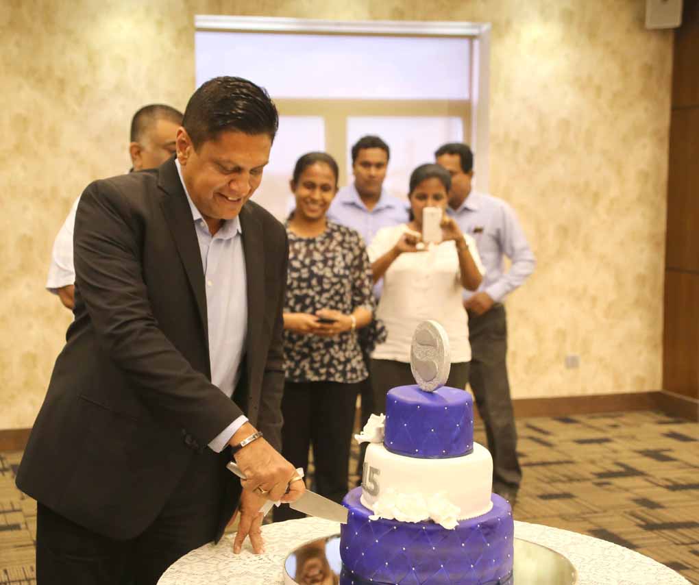 Sudath Perera cutting the cake to commemorate the occasion