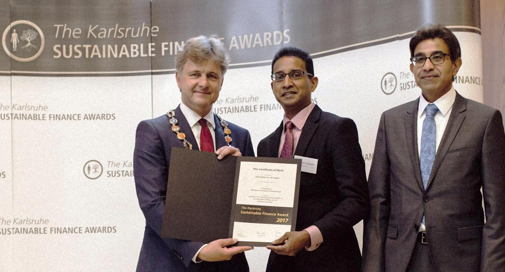 Senaka Jayasinghe, receiving the award from Dr. Frank Mentrup, Lord Mayor of Karlsruhe in the presence of Arshad Rab – CEO of the European Organisation for Sustainable Development