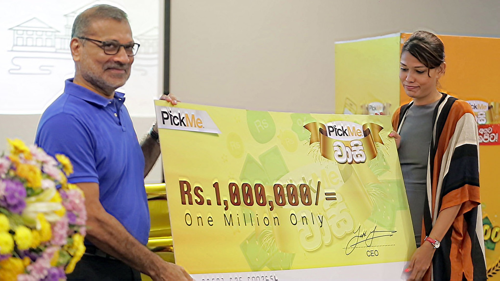 Ajit Gunewardene handing over the Rs. 1 million cheque to . Joanne De La Zilwa