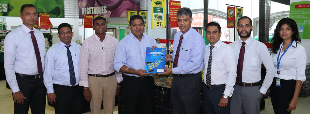 Mobitel Chief Executive Officer Nalin Perera exchanging the partnership agreement with Jaykay Marketing Services Chief Executive Officer Charitha Subasinghe. Also present were (from left) Mobitel Manager Mobile Financial Services Padmanath Muthukumarana, Mobitel Head of Mobile Financial Services Kalhara Gamage, Mobitel Senior General Manager Marketing Isuru Dissanayaka, Jaykay Marketing Services Head of IT Osanda Warnakulasuriya, Jaykay Marketing Services Manager Finance Eranga Illangasinghe and Mobitel Assistant Manager Mobile Financial Services Sachini Silva.