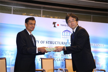 1 - Dr. Shingo Asamoto, Associate Professor at Saitama University of Japan, being felicitated by Eng. K.L.S. Sahabandu, President of the Society of Structural Engineers, Sri Lanka