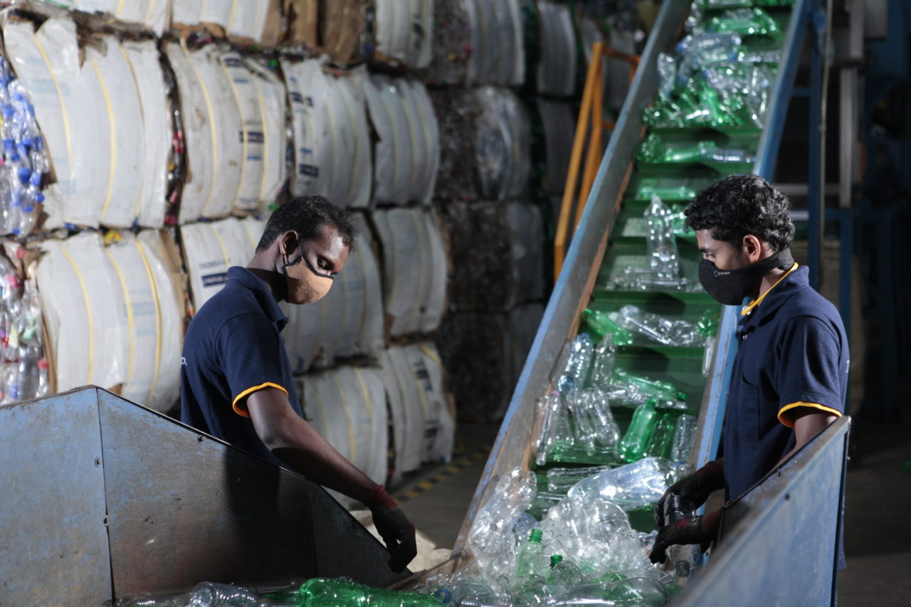 PET bottles feeding into the recycling machine