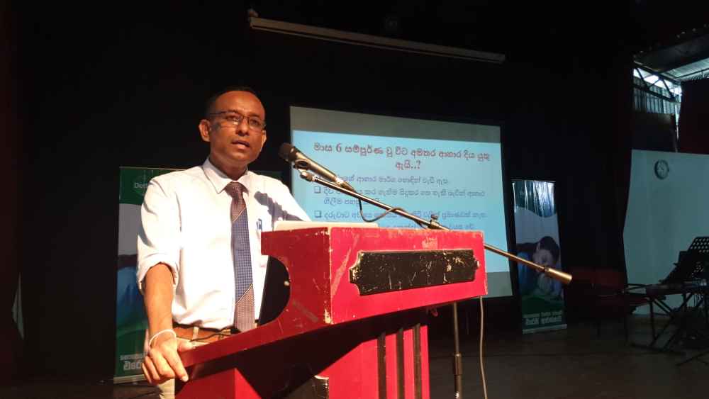 A doctor at the seminar delivering a session on maintaining good hygiene and nutrition (LBN)