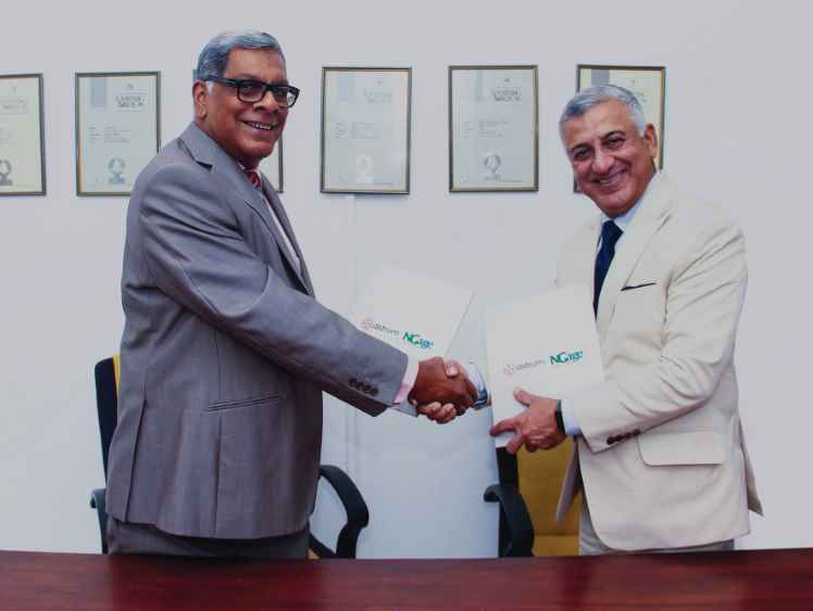 Nimal and Ashwani exchanging signed partnership agreement (LBN)