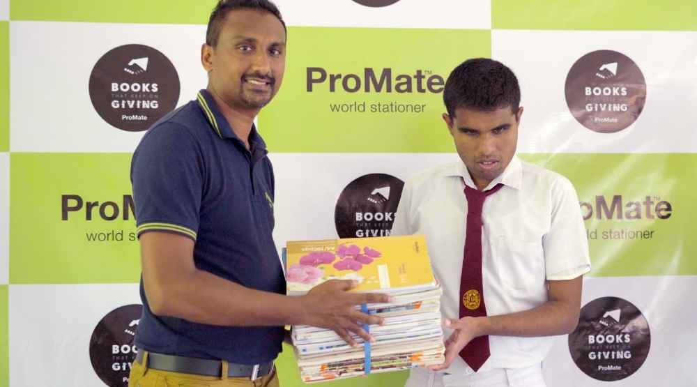 Promate hands over exercise books to the Principal of Yashodara Deaf and Blind School, Balangoda. (LBN)