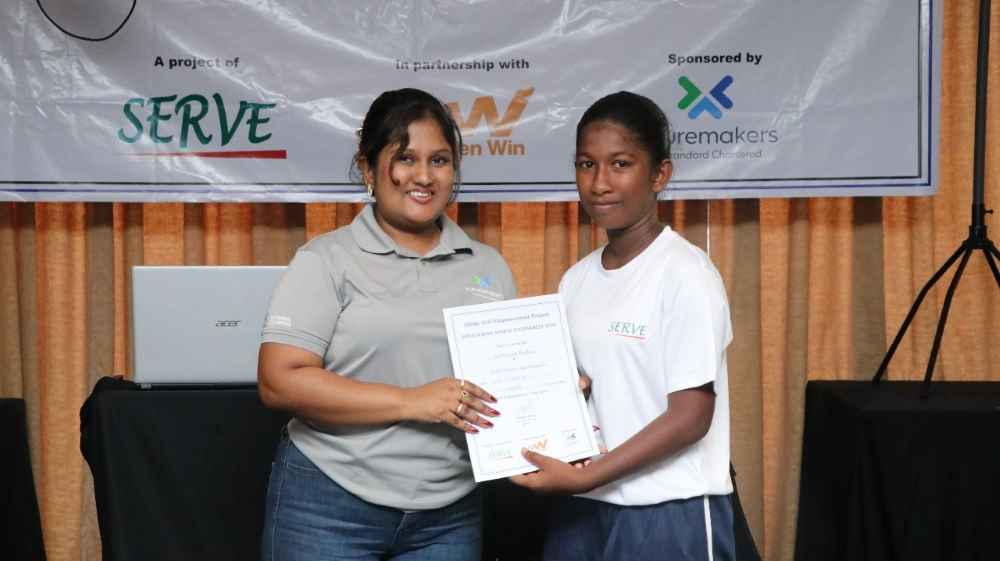 Shenuka Katukurunda - Assistant Manager Corporate Affairs Standard Chartered Sri Lanka pictured with a Goal beneficiary (LBN)